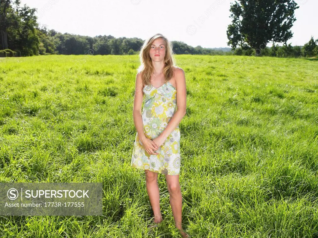 Young woman standing in a field
