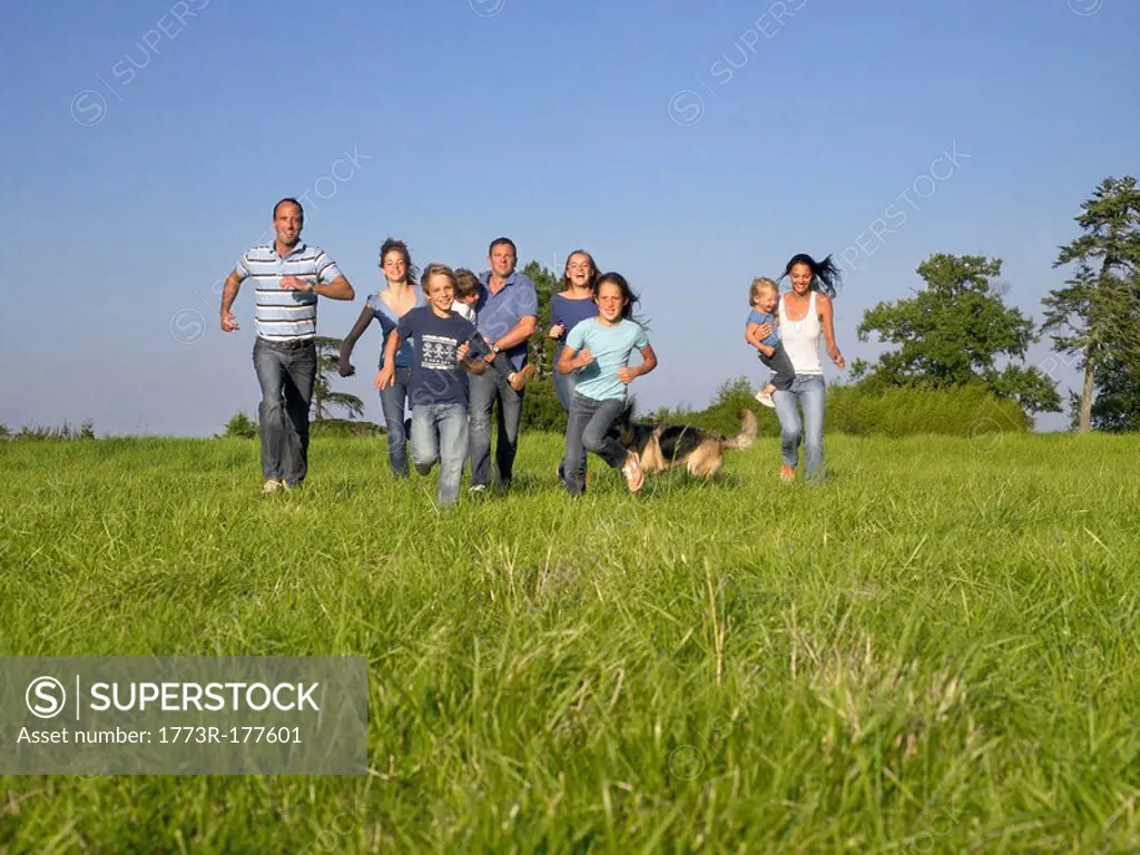 Group of people and children running