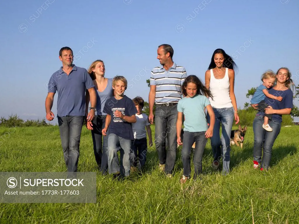 Group of people and children walking