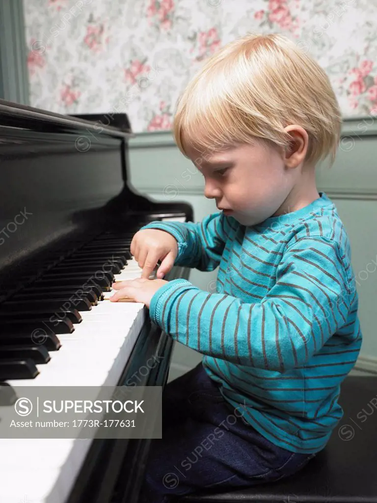 Little boy playing piano