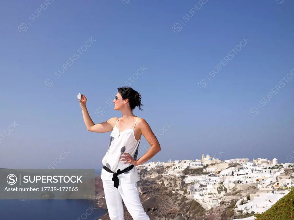 Woman taking pictures of the view