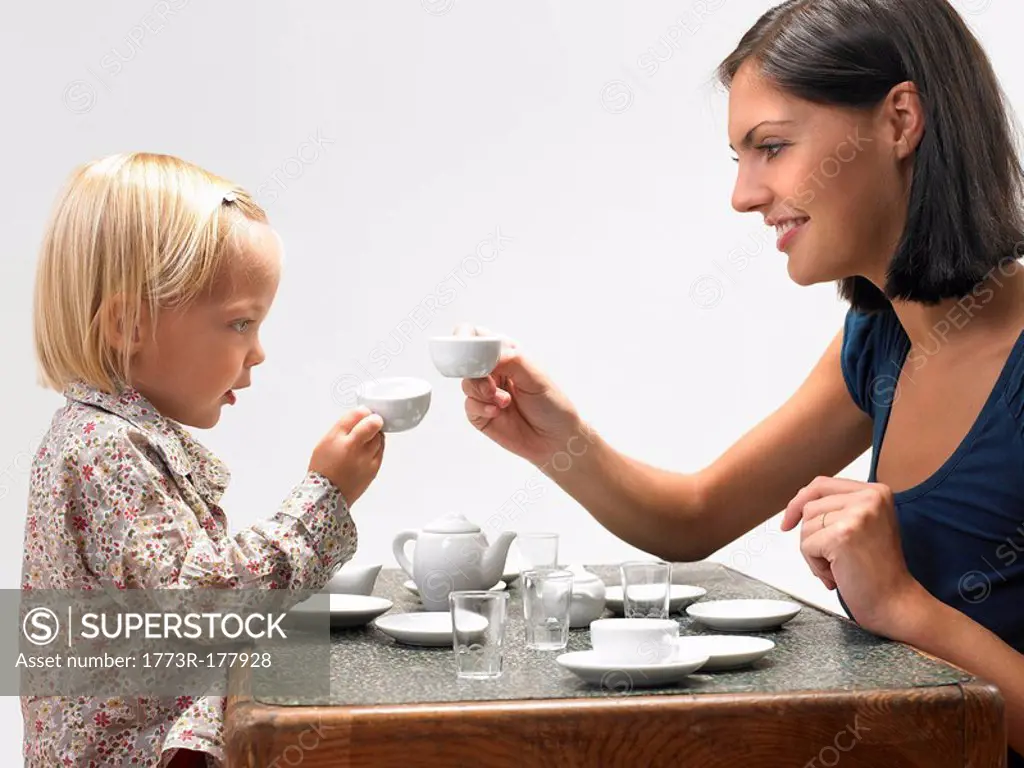 Daughter and mother having tea