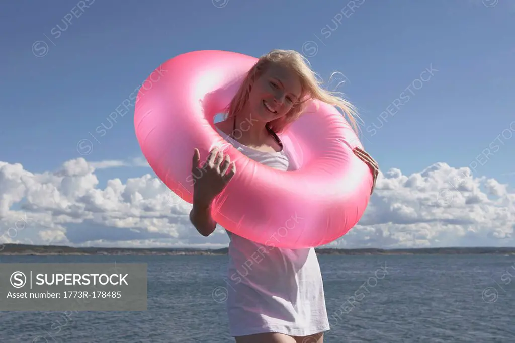Young woman with swimming ring