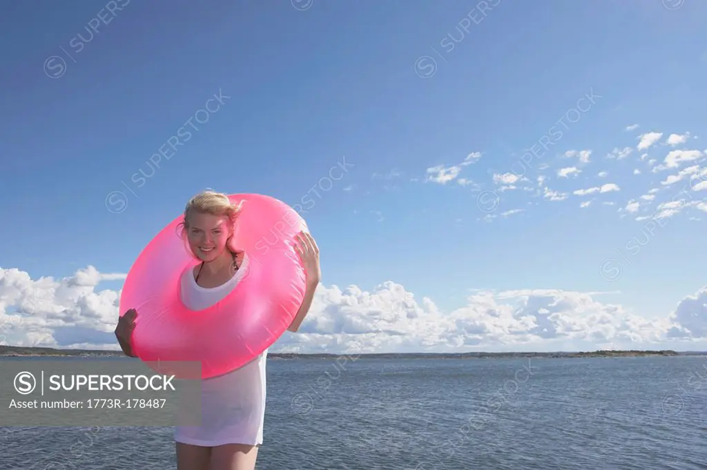 Young woman with swimming ring