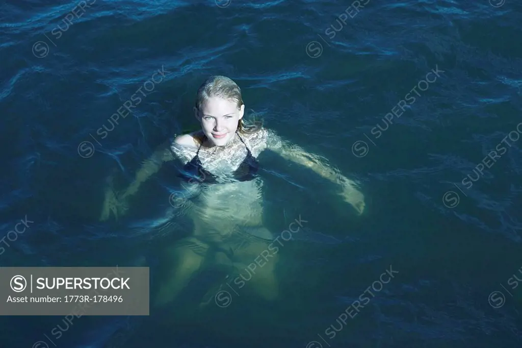 Young Woman Swimming in the Sea