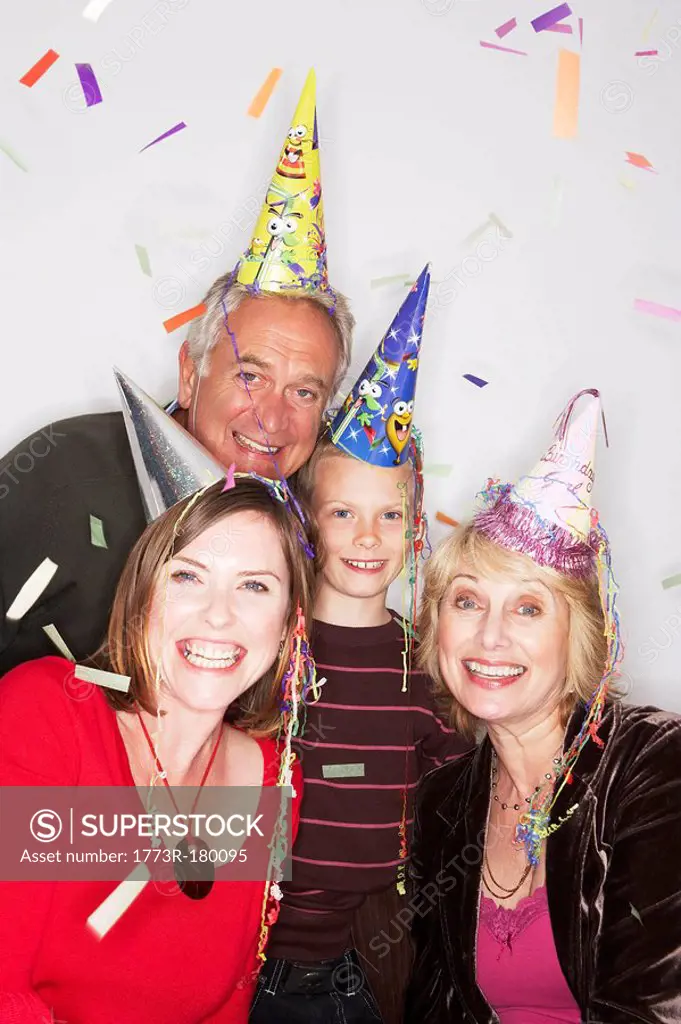 3 generation family in party hats