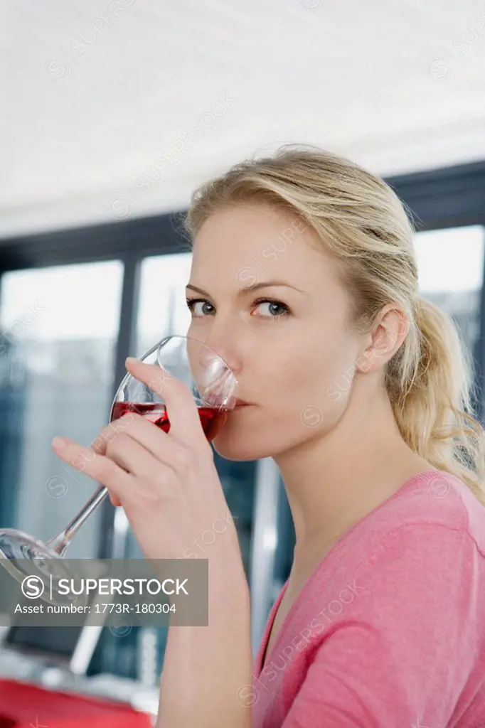 Portrait of a woman drinking wine