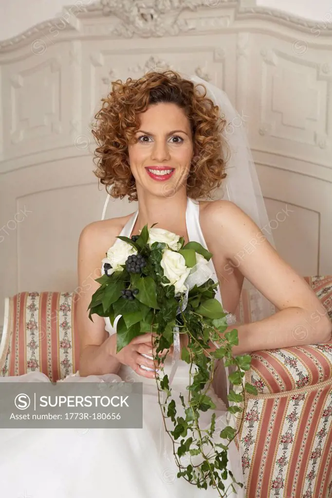 young bride holding bridal bouquet, portrait