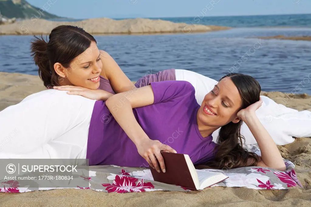 Two young women relaxing on beach