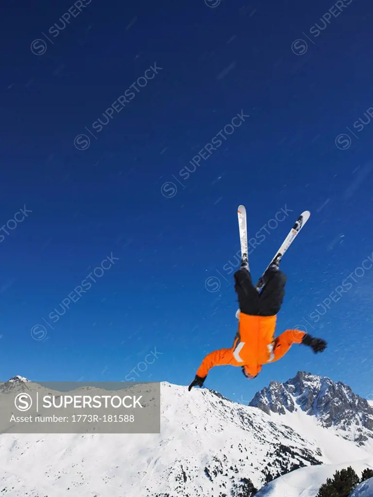 Skier jumping upside down