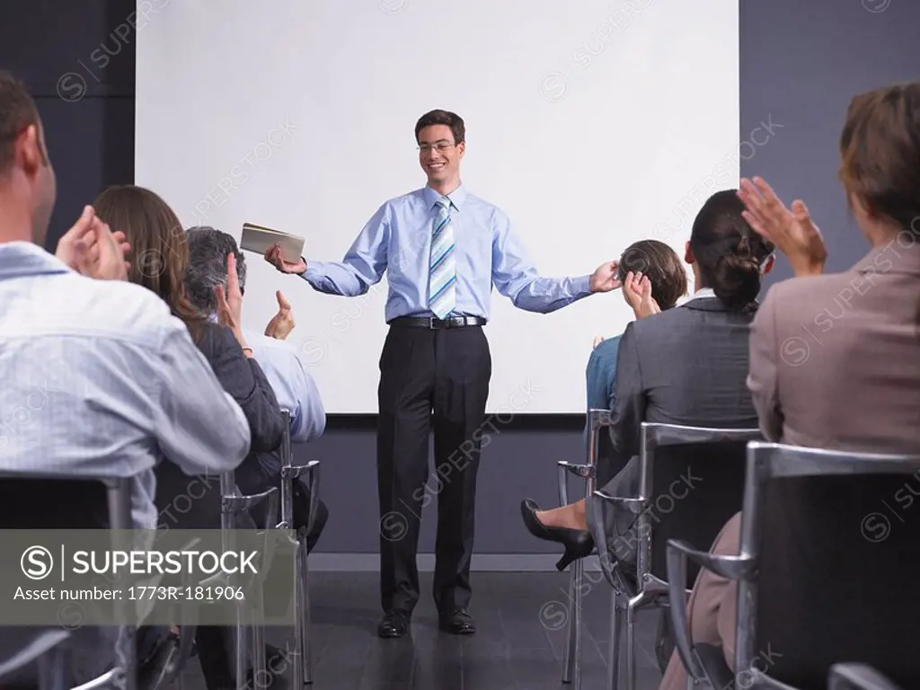 Man giving speech in presentation room