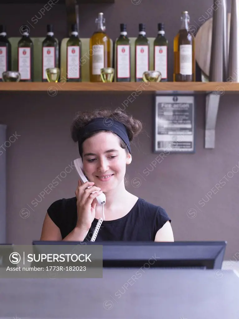 Hostess at her station in a restaurant