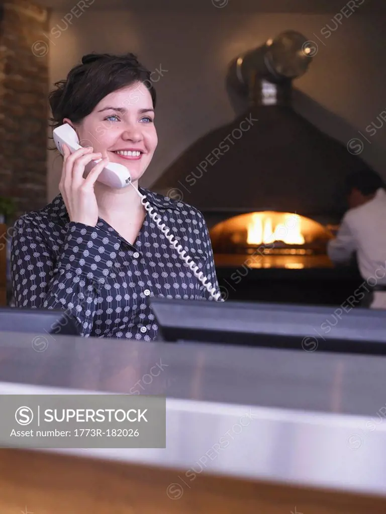 Hostess at her station in a restaurant