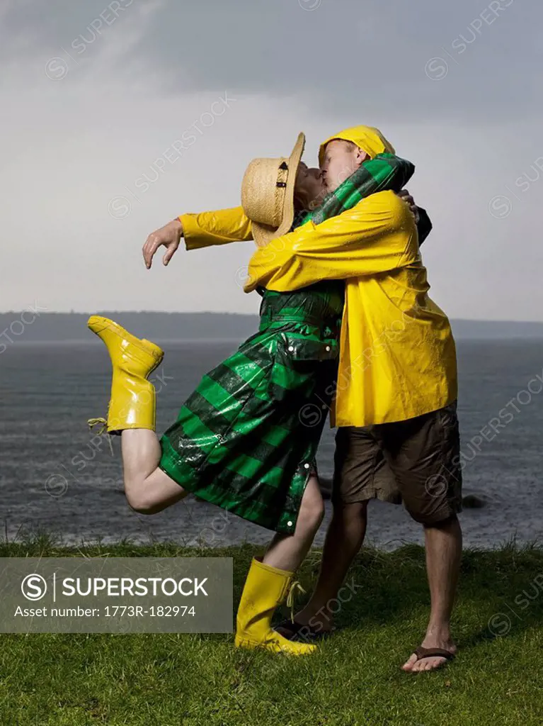 Couple kissing and hugging in the rain