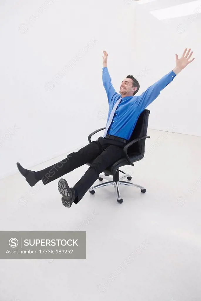 Man speeds through office on chair