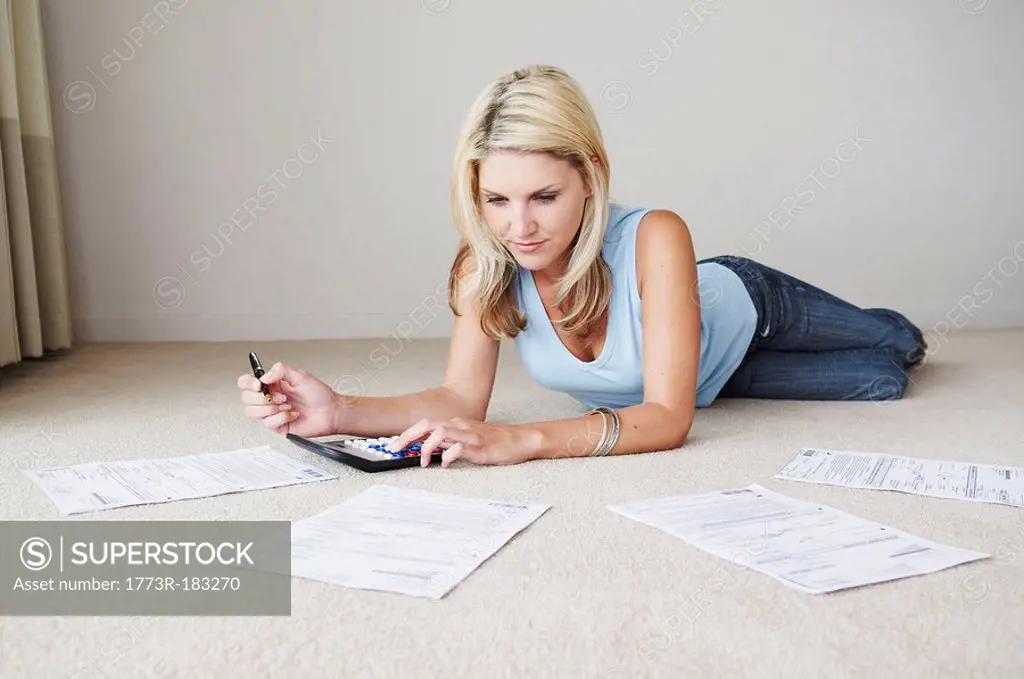 Woman works on home finances