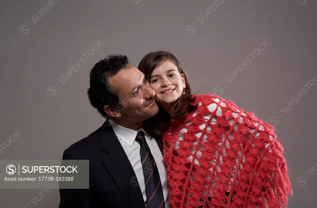 Businessman and daughter 9-11 smiling