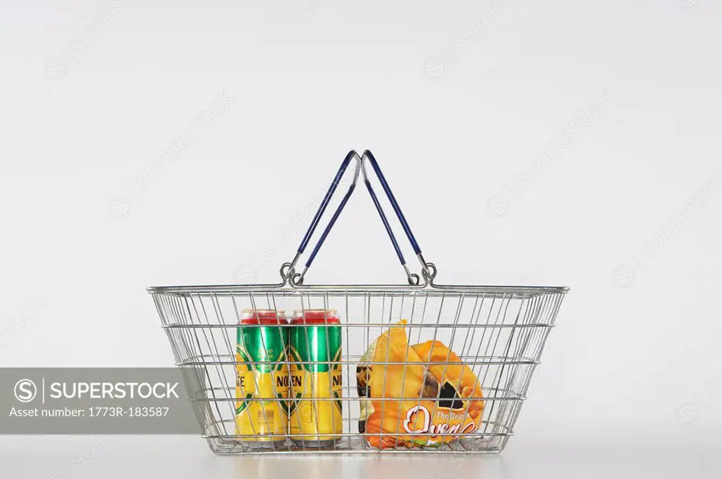 A shopping basket with two beers and frozen French fries