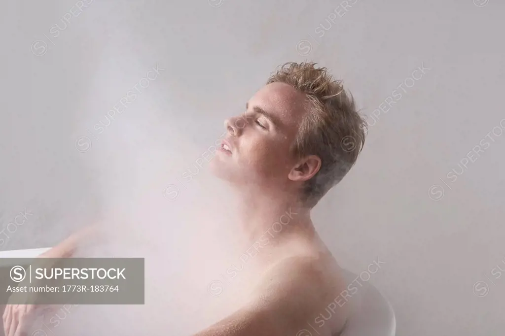 Man in bath with steam