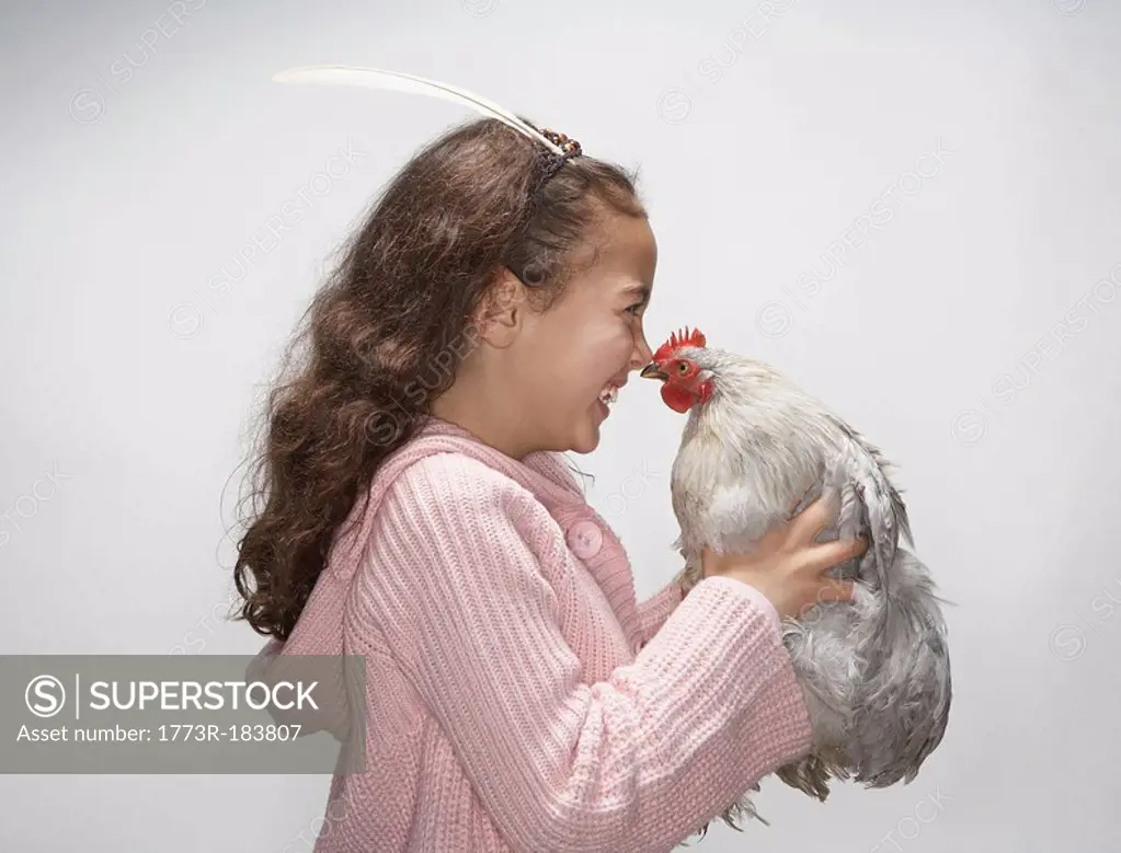 Girl looking at hen