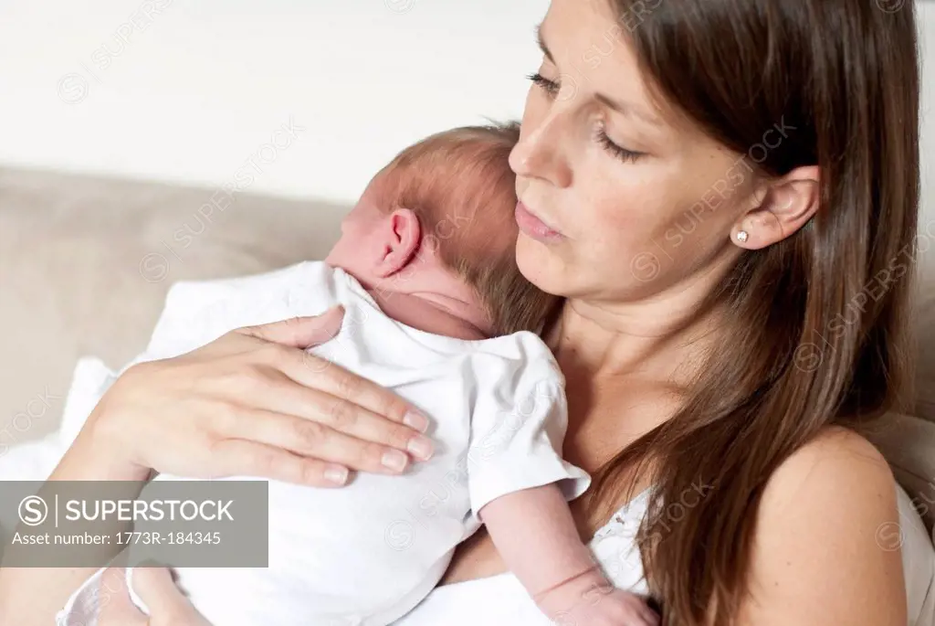 Mother holding infant son