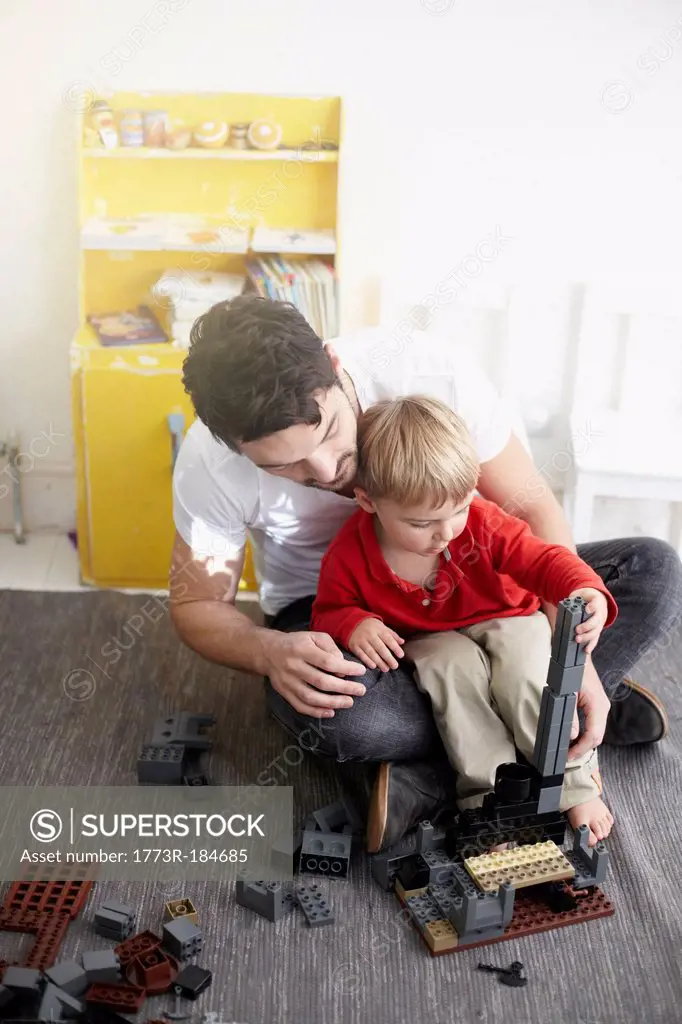 Father and son building with blocks