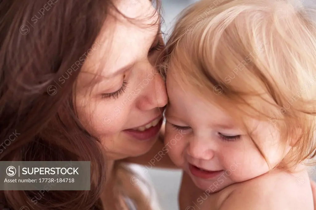 Close up of mother holding daughter