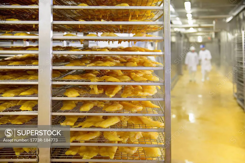 Cart of smoked fish in factory