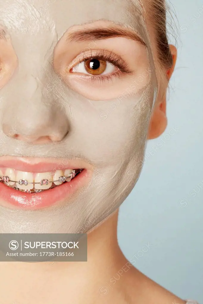Smiling girl wearing face mask