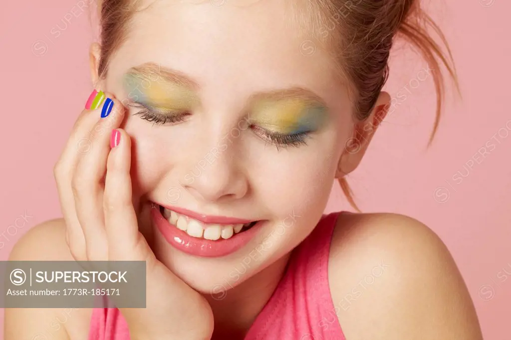 Smiling girl wearing colorful makeup