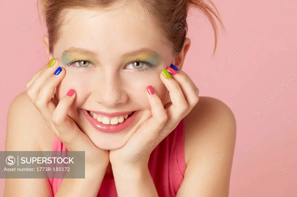 Smiling girl wearing colorful makeup