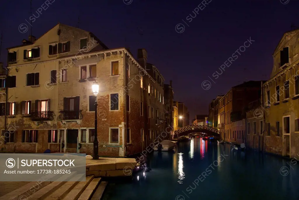 City lights reflected in urban canal