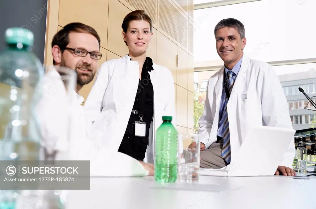 Doctors smiling at desk