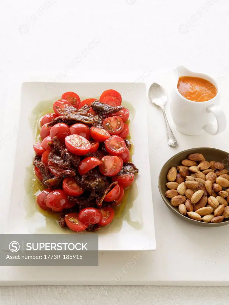 Plate of tomato salad with almonds