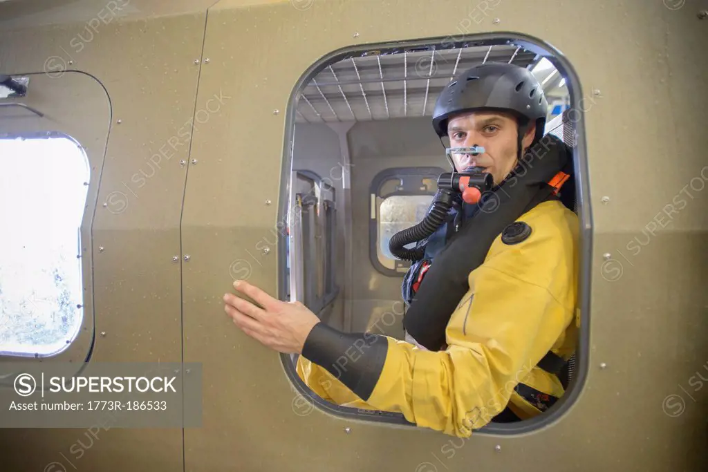 Oil worker in simulated helicopter