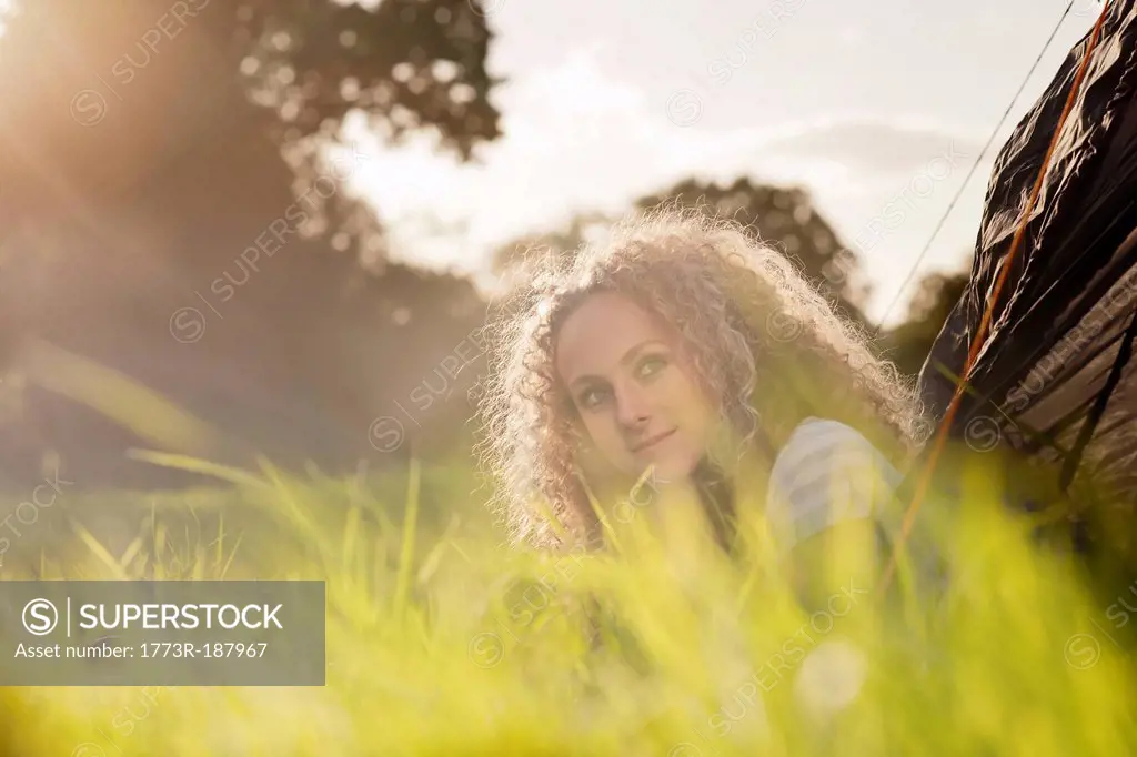 Teenage girl sitting in grass