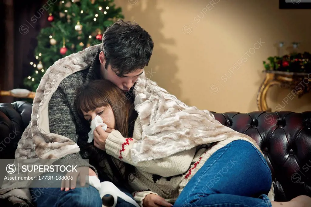 Man hugging crying girlfriend