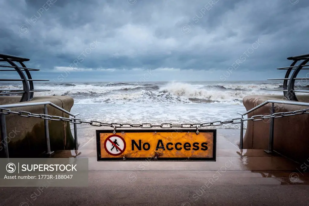No access” sign at stormy beach