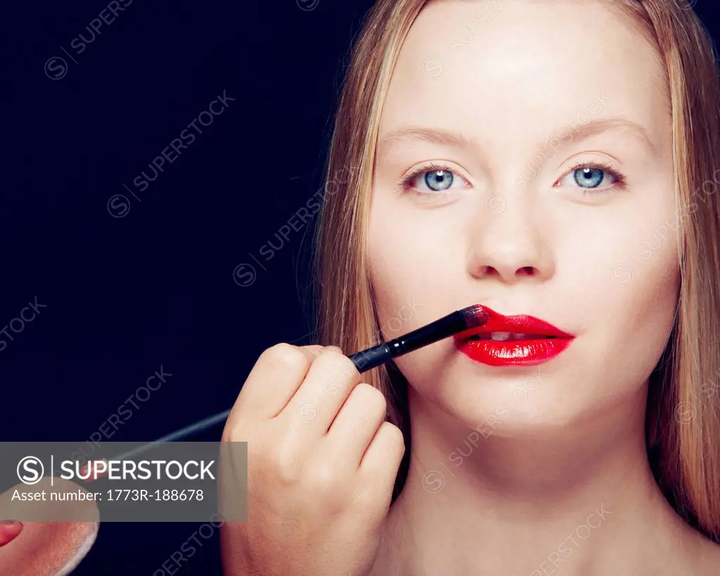 Woman having makeup applied