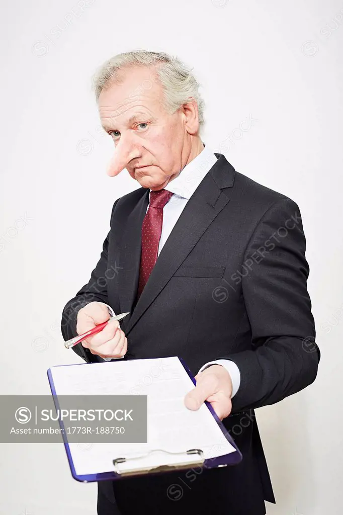 Businessman with long nose and contract
