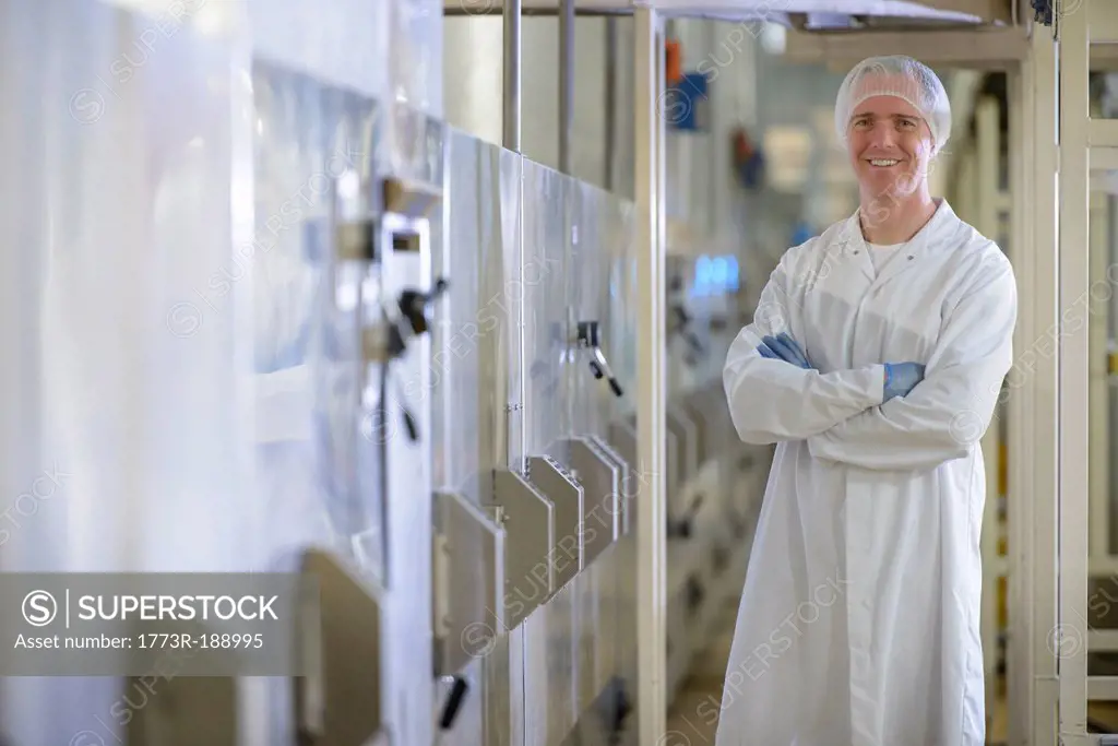 Worker smiling in biscuit factory