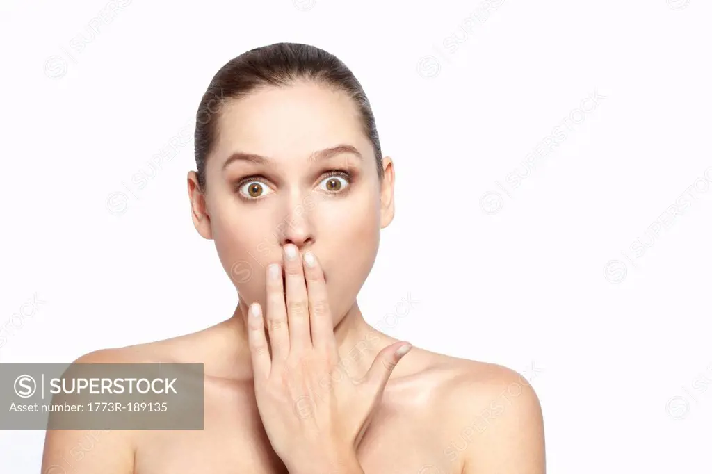 Surprised woman covering her mouth