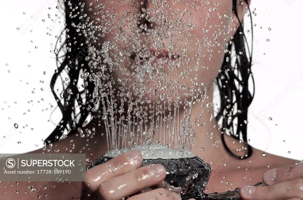 Woman holding shower head
