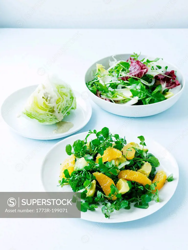 Watercress, avocado and orange salad, iceberg and Italian bitter leaf salad