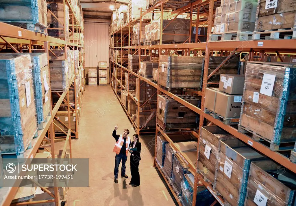 Worker and supervisor in warehouse