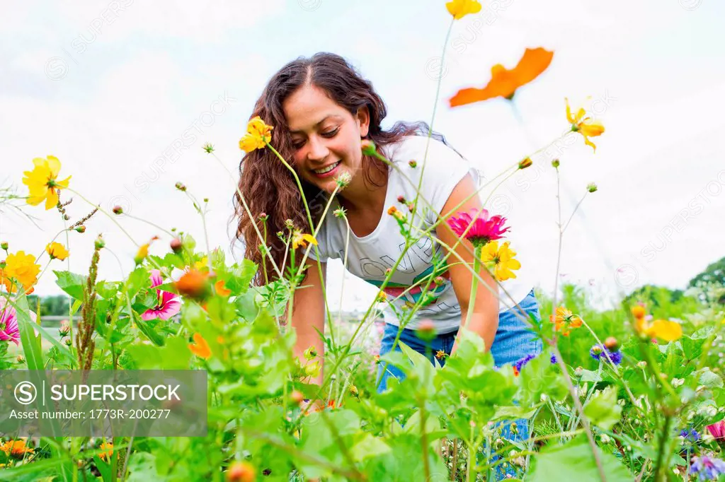 Young woman gardening in allotment