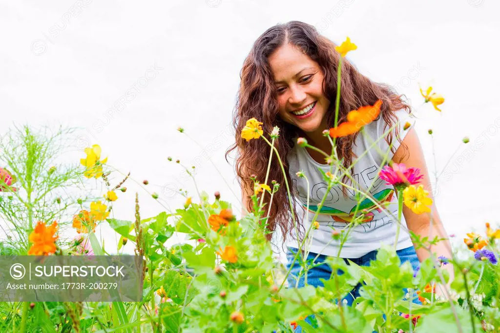 Young woman gardening in allotment