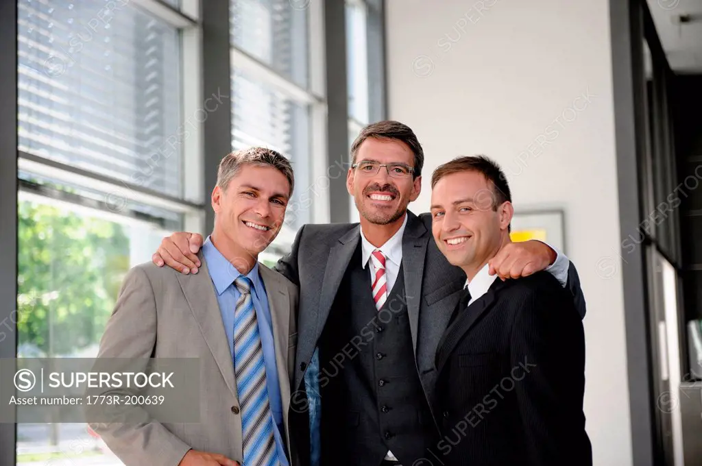 Portrait of three smiling businessmen