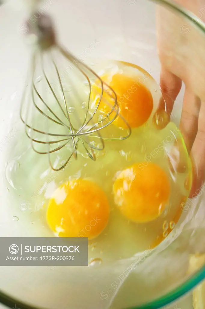 Person whisking eggs
