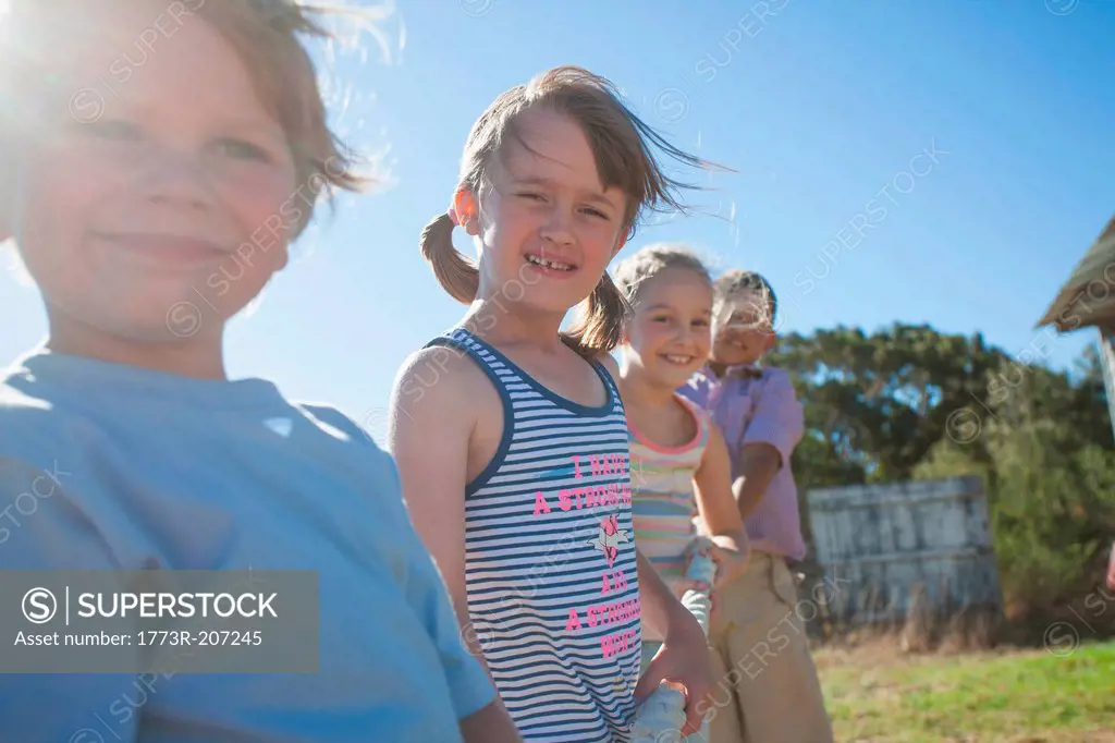 Four children outside in summer